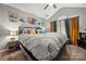 Cozy main bedroom features a large comfy bed, ample natural light, and stylish decor at 5310 Glenlea Walk Ln, Charlotte, NC 28216