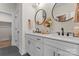 Modern bathroom featuring double sinks, round mirrors, and white cabinetry offering a clean, stylish aesthetic at 706 Falling Oak Aly # 16, Huntersville, NC 28078