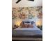 Charming bedroom with floral wallpaper, cozy bedding, and stylish bedside lamps creating a relaxing retreat at 706 Falling Oak Aly # 16, Huntersville, NC 28078