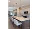 Well-appointed kitchen with a large island, marble countertops, and modern stainless steel appliances at 706 Falling Oak Aly # 16, Huntersville, NC 28078