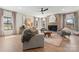 Bright living room features elegant decor, fireplace, and seamlessly connects indoor and outdoor spaces at 706 Falling Oak Aly # 16, Huntersville, NC 28078