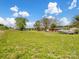 A vast backyard showcases a boat, shed, and expansive green space, with a home and farm buildings in the distance at 7516 Pageland Hwy # 3, Monroe, NC 28112