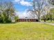 Brick ranch style home with mature trees in a quiet rural setting at 7516 Pageland Hwy # 3, Monroe, NC 28112