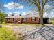 Charming brick ranch with mature trees and a covered parking area at 7516 Pageland Hwy # 3, Monroe, NC 28112