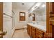 Traditional bathroom features a single sink vanity, walk-in shower and a window offering natural light at 862 Eastwood Dr, Rock Hill, SC 29730