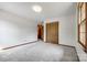 Bedroom featuring neutral carpet, a modern light fixture and a double-door closet at 862 Eastwood Dr, Rock Hill, SC 29730