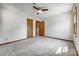 Carpeted bedroom featuring neutral walls, and access to two wooden closets and a bathroom at 862 Eastwood Dr, Rock Hill, SC 29730