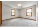 Bedroom featuring neutral carpet, natural light from two windows and a closet at 862 Eastwood Dr, Rock Hill, SC 29730