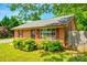 Quaint brick home featuring tidy landscaping, red shutters, and a well-kept lawn at 862 Eastwood Dr, Rock Hill, SC 29730