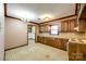 Traditional kitchen with wooden cabinets, tile countertops, chandelier, and vintage appliances at 862 Eastwood Dr, Rock Hill, SC 29730