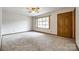 Bright living room featuring carpet flooring, a large window, and a classic ceiling fan at 862 Eastwood Dr, Rock Hill, SC 29730