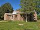 Brick home exterior with green lawn and trees on a sunny day at 8860 Castor Rd, Salisbury, NC 28146