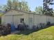 Large, bright, metal outbuilding with a flat lawn on a sunny day at 8860 Castor Rd, Salisbury, NC 28146