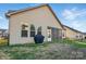 This backyard includes a covered area, a large lawn, and a privacy fence at 9565 Horsebit Ln, Concord, NC 28027