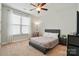 Calm bedroom with cozy bed and large window at 9565 Horsebit Ln, Concord, NC 28027