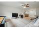 Large bonus room boasts plush carpet, a ceiling fan, and an area with a table and chairs at 9565 Horsebit Ln, Concord, NC 28027