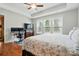 Bedroom with hardwood floors, tray ceiling, and a large window provides natural light at 9565 Horsebit Ln, Concord, NC 28027