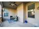 Covered porch with outdoor seating and a view of the backyard at 9565 Horsebit Ln, Concord, NC 28027
