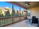 Relaxing screened porch with seating offers views of the backyard and surrounding trees at 9565 Horsebit Ln, Concord, NC 28027