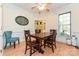 Elegant dining room with hardwood floors, wainscoting, and a view into the living room at 9600 Lockhorn Ct, Mint Hill, NC 28227