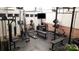 Well equipped home gym with varied machines, weights, benches, TV and rubber flooring at 9600 Lockhorn Ct, Mint Hill, NC 28227