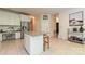 Kitchen with tiled flooring, stainless steel refrigerator, and a central island with granite countertop at 9600 Lockhorn Ct, Mint Hill, NC 28227