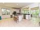 Bright kitchen boasts white cabinets, stainless steel appliances, and a center island with seating at 9600 Lockhorn Ct, Mint Hill, NC 28227