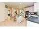 Bright kitchen with white cabinets, an island with seating, and stainless steel appliances at 9600 Lockhorn Ct, Mint Hill, NC 28227