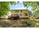The home's backyard features a wooden deck, shed and lush green lawn at 1007 Doby Springs Dr, Charlotte, NC 28262