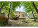 The home's backyard features a wooden deck, shed and lush green lawn at 1007 Doby Springs Dr, Charlotte, NC 28262