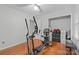 Bedroom space with exercise equipment, ceiling fan and wood floors at 1007 Doby Springs Dr, Charlotte, NC 28262