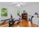 Bedroom space with windows, ceiling fan and wood floors at 1007 Doby Springs Dr, Charlotte, NC 28262