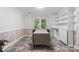 Bright dining area features built-in shelving, wainscoting, and views of the backyard at 1007 Doby Springs Dr, Charlotte, NC 28262