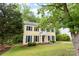 Charming two-story home with green shutters and beautifully landscaped yard at 1007 Doby Springs Dr, Charlotte, NC 28262