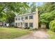 Charming two-story home with blue shutters, landscaped yard, and shed at 1007 Doby Springs Dr, Charlotte, NC 28262
