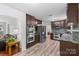 Open-concept kitchen featuring stainless steel appliances and a view into the living room at 1007 Doby Springs Dr, Charlotte, NC 28262