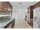 View of the Kitchen with updated cabinets and floors plus stainless steel appliances at 1007 Doby Springs Dr, Charlotte, NC 28262