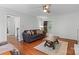 Bright living room with hardwood floors and ceiling fan at 1007 Doby Springs Dr, Charlotte, NC 28262