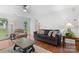 Comfortable living room area with couch and armchair at 1007 Doby Springs Dr, Charlotte, NC 28262