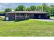Expansive backyard with a well-maintained lawn and mature trees, offering privacy and outdoor enjoyment at 1012 Burrage Ne Rd, Concord, NC 28025