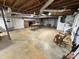 Unfinished basement with exposed beams, ductwork, and a fireplace at 1012 Burrage Ne Rd, Concord, NC 28025