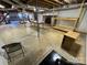 Unfinished basement with exposed beams, ductwork, a fireplace, and unfinished shelving at 1012 Burrage Ne Rd, Concord, NC 28025