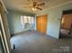 Bedroom with a window, closet, ceiling fan, and a view to another room at 1012 Burrage Ne Rd, Concord, NC 28025
