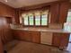 Functional kitchen with an undermount sink, white dishwasher, and lots of natural light at 1012 Burrage Ne Rd, Concord, NC 28025
