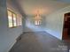 Open living area featuring ample natural light and a view of the backyard at 1012 Burrage Ne Rd, Concord, NC 28025