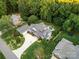 Aerial view of a beautiful home with a pool, lush landscaping, and ample yard space at 1068 Grant Dr, Denver, NC 28037