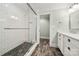 Bathroom featuring a walk-in shower with tile surround, tile flooring, and stylish fixtures at 1068 Grant Dr, Denver, NC 28037