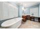 Elegant bathroom with a freestanding tub, dual vanities, and modern fixtures at 1068 Grant Dr, Denver, NC 28037