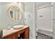 Charming bathroom features a vessel sink, decorative mirror, and white subway tile shower at 1068 Grant Dr, Denver, NC 28037