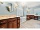 Luxurious bathroom with a freestanding tub, dual vanities, and stylish fixtures at 1068 Grant Dr, Denver, NC 28037